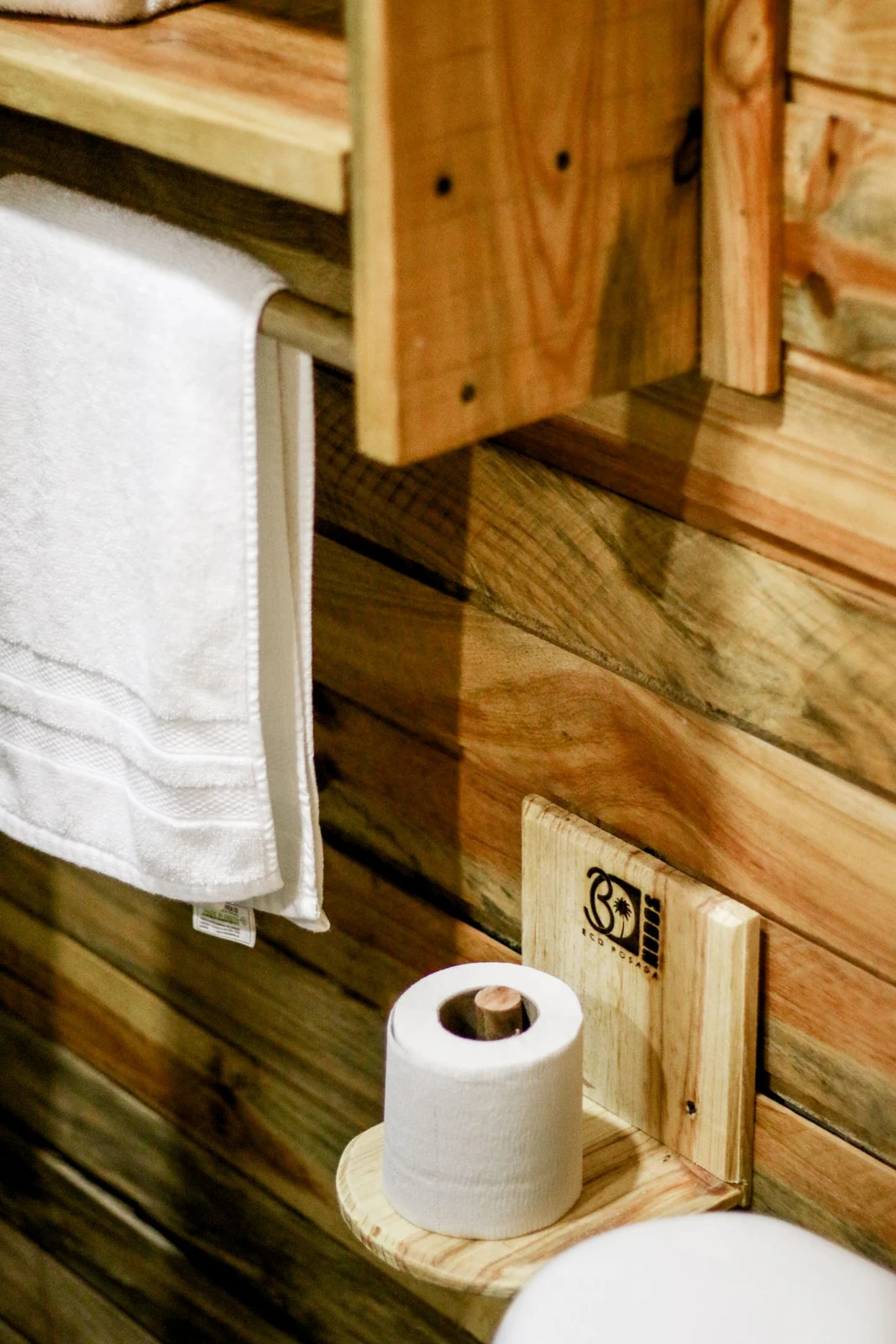 Bathroom towel storage on a timber wall