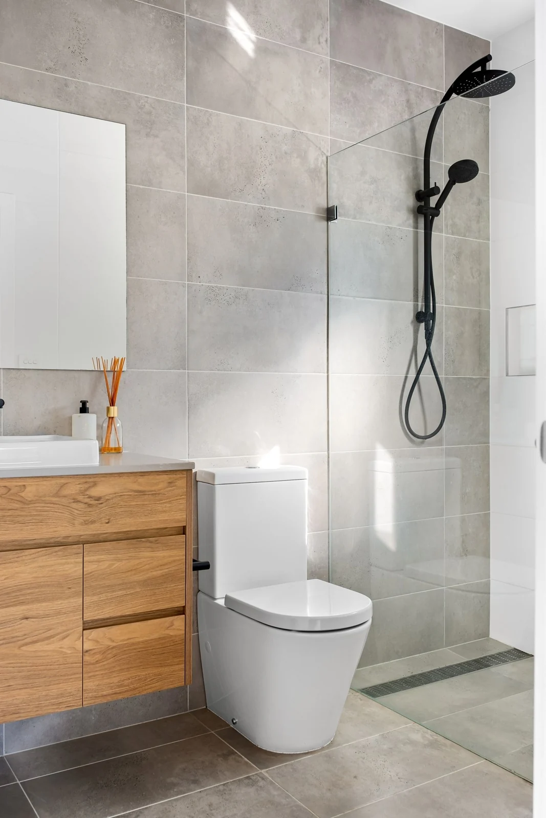 Sleek minimalist bathroom interior featuring a stylish shower and contemporary fittings
