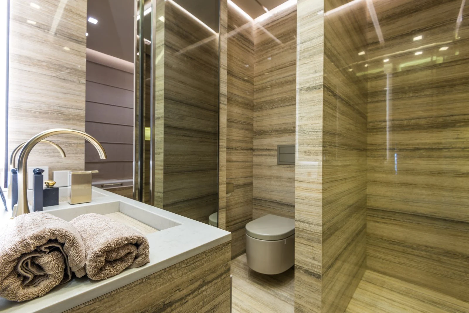 Elegant and luxurious bathroom interior with marble walls and sleek fixtures