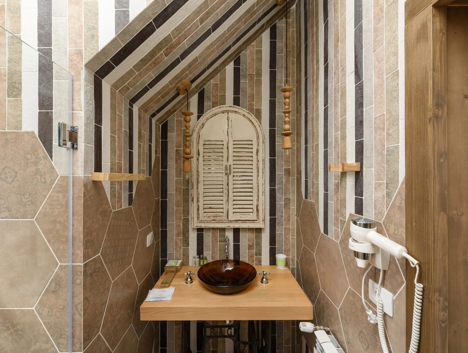 A modern bathroom featuring rustic elements and patterned tiles for a chic design